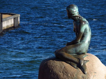 Close-up of sea against blue sky