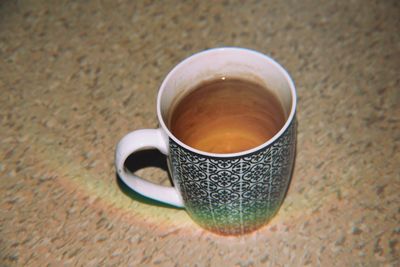 High angle view of coffee cup on table