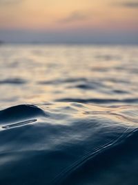 Aerial view of sea against sky during sunset