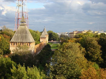 Traditional building on field against sky