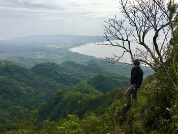 Man on mountain against sky