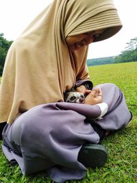 Dog relaxing on grass