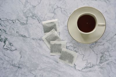 High angle view of coffee cup on table