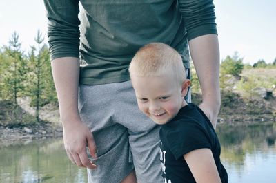 Portrait of father and son on shore