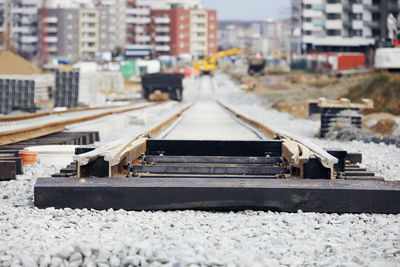 Railroad tracks in city during winter