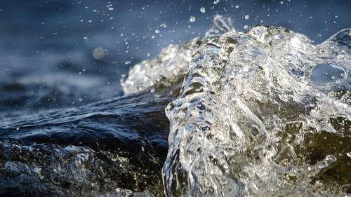 Close-up of water splashing on rocks