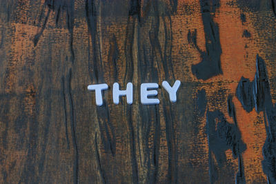 Close-up of text on wood