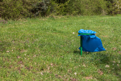 Blue umbrella on field