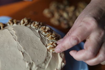 Close-up of hand holding ice cream