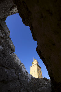 Tower of hercules seen amidst rock
