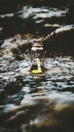 Close-up of cigarette in water