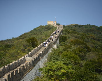 Tourist on great wall of china against sky