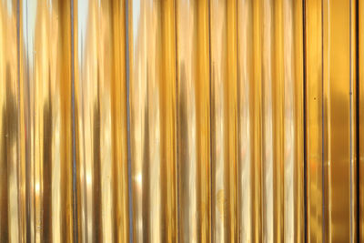 Golden brass metal relief with vertical lines