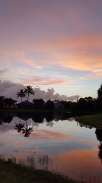 Scenic view of calm lake at sunset
