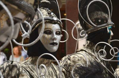 Close-up of woman wearing mask and costume