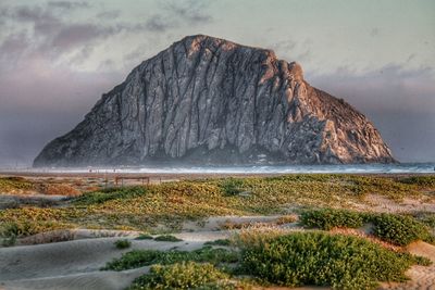 Scenic view of sea and rocks against sky