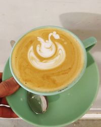 Close-up of cappuccino served on table