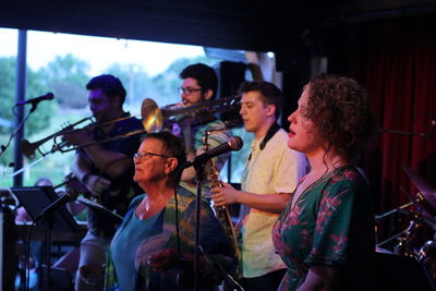 Group of people playing in music concert