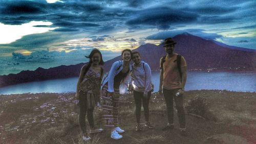 Panoramic view of people on landscape against sky