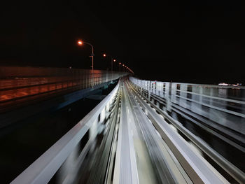 Light trails on road at dark night.