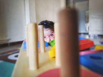 Portrait of girl playing at home