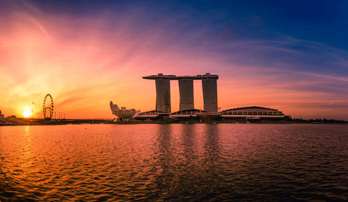 Silhouette of building at sunset