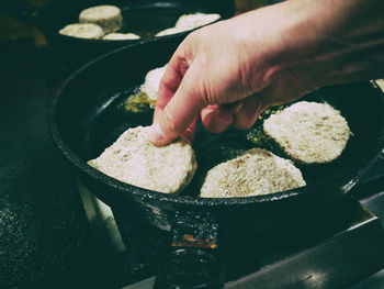 Close-up of person preparing food in bowl