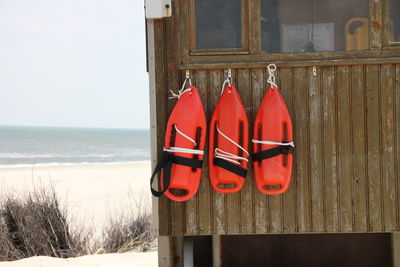 Surfboards mounted on wall at beach