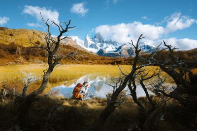 Man photographing lake at el chalten