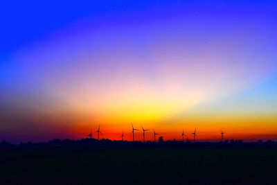 Scenic view of silhouette landscape against romantic sky at sunset