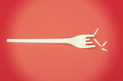 High angle view of umbrella against red background