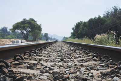 Surface level of railroad track against sky