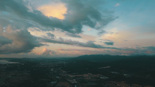 Aerial view of townscape against sky at sunset