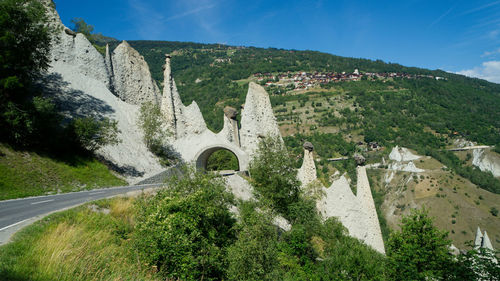 Scenic view of tree mountains against sky