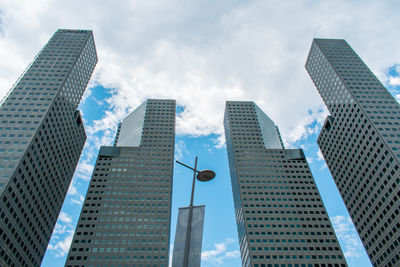 Low angle view of modern buildings against sky