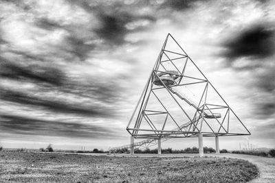 Crane on field against sky