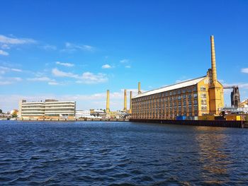 View of cityscape against blue sky