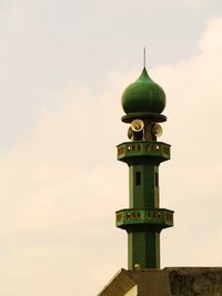 Low angle view of bell tower against sky during sunset