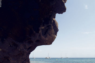 View of sea through cliff