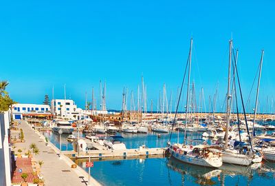 Boats moored at harbor