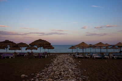 Scenic view of beach against sky during sunset