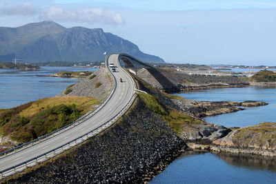 High angle view of road by sea against sky