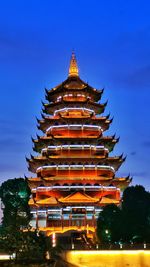 Low angle view of pagoda against building