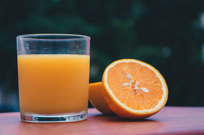 Close-up of orange juice on table