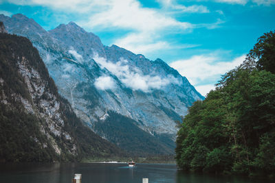 Scenic view of lake and mountains against sky