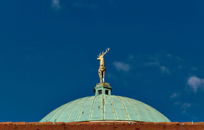 Statue of liberty against blue sky