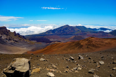Scenic view of mountains against cloudy sky