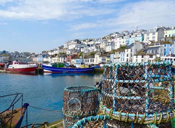 Brixham harbour with crab pots in the foreground