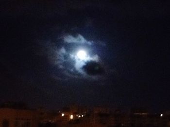 Low angle view of moon in sky at night