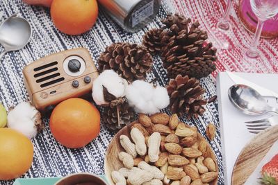 High angle view of food by pine cones on table